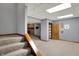 Finished basement with open closet, carpeted stairs, and brick fireplace at 4606 Sundance Trl, Indianapolis, IN 46239