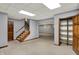 Finished basement featuring an open staircase, carpeted floors, and a closet at 4606 Sundance Trl, Indianapolis, IN 46239
