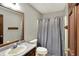 Bathroom featuring vanity, mirror, wooden accents, and a shower-tub combination at 4606 Sundance Trl, Indianapolis, IN 46239