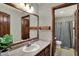 Bathroom with vanity, mirror, wooden accents, and shower-tub combination at 4606 Sundance Trl, Indianapolis, IN 46239