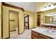 Bright bathroom with double vanity, toilet room, and walk-in closet at 4606 Sundance Trl, Indianapolis, IN 46239