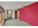 Spacious bedroom with walk-in closet, bright accent wall, and carpet flooring at 4606 Sundance Trl, Indianapolis, IN 46239