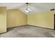 Bedroom featuring neutral carpet, high ceiling with fan, and wood trim at 4606 Sundance Trl, Indianapolis, IN 46239