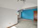 Spacious bedroom with blue accent wall, carpeted floors, and ample natural light at 4606 Sundance Trl, Indianapolis, IN 46239