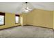 Spacious bedroom with high ceilings, neutral carpet, and bright windows at 4606 Sundance Trl, Indianapolis, IN 46239