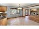 Eat-in kitchen view of the open floor plan dining room and living room with fireplace at 4606 Sundance Trl, Indianapolis, IN 46239