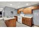 Basement kitchenette area features wood cabinets, countertops and white appliances at 4606 Sundance Trl, Indianapolis, IN 46239