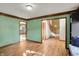 Spacious living room featuring hardwood floors, an open doorway, and ample natural light at 4606 Sundance Trl, Indianapolis, IN 46239