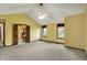 Vaulted primary bedroom featuring neutral carpet, ceiling fan, and windows providing plenty of natural light at 4606 Sundance Trl, Indianapolis, IN 46239