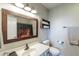 Bathroom with classic vanity, toilet, and decorative mirror at 5875 Annanhill Ct, Avon, IN 46123