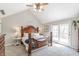 Inviting bedroom with natural light, ceiling fan, and cozy decor at 5875 Annanhill Ct, Avon, IN 46123