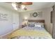 Cozy bedroom with decorative wreath, ceiling fan, and comfortable furnishings at 5875 Annanhill Ct, Avon, IN 46123