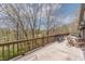 Expansive wooden deck offers picturesque views of the surrounding trees and nature at 5875 Annanhill Ct, Avon, IN 46123