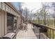 Spacious wooden deck area with outdoor seating and planter boxes overlooking a wooded landscape at 5875 Annanhill Ct, Avon, IN 46123