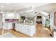 Open kitchen featuring granite countertops, stainless steel appliances, and bright, open access to the living room at 5875 Annanhill Ct, Avon, IN 46123