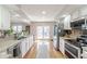 Bright kitchen features granite countertops, stainless steel appliances, and access to the backyard at 5875 Annanhill Ct, Avon, IN 46123