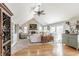 Spacious living room with vaulted ceilings, stone fireplace, plush carpeting, and access to outdoor living space at 5875 Annanhill Ct, Avon, IN 46123
