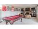 Game room with brick fireplace, pool table, and memorabilia displayed at 5875 Annanhill Ct, Avon, IN 46123