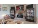 Cozy living room features a brick fireplace, TV, and comfortable seating at 5875 Annanhill Ct, Avon, IN 46123