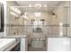This spacious tiled shower features dual shower heads, a glass enclosure, and a built-in bench at 5875 Annanhill Ct, Avon, IN 46123