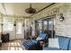 Relaxing sunroom featuring wicker furniture, a mini fridge, and serene views at 5875 Annanhill Ct, Avon, IN 46123