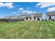 Spacious backyard featuring a lush green lawn and well-maintained fence providing privacy at 6103 Pebblebrooke Rd, Whitestown, IN 46075