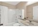 Bathroom featuring a shower-tub combo, a toilet, a vanity with sink, and a cabinet at 6103 Pebblebrooke Rd, Whitestown, IN 46075