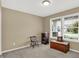 Cozy bedroom with a bright window with street view, chair and hardwood furniture accents at 6103 Pebblebrooke Rd, Whitestown, IN 46075