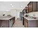 Open kitchen layout with stainless steel appliances and ample cabinet space, great for cooking at 6103 Pebblebrooke Rd, Whitestown, IN 46075
