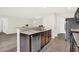 Bright kitchen featuring stainless steel dishwasher, sink and open access to the living area at 6103 Pebblebrooke Rd, Whitestown, IN 46075