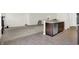 Open-concept kitchen with stainless steel dishwasher, adjacent to living area, perfect for entertaining at 6103 Pebblebrooke Rd, Whitestown, IN 46075