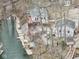 Aerial view of two lakeside homes with docks, decks and stairs surrounded by trees at 6141 Flamingo Dr, Nineveh, IN 46164