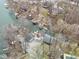 An aerial view of waterfront homes with private docks surrounded by lush trees at 6141 Flamingo Dr, Nineveh, IN 46164