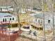 Aerial view of lakeside home with outdoor seating, hot tub and multiple decking areas at 6141 Flamingo Dr, Nineveh, IN 46164