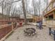 Inviting backyard featuring a hot tub, fire pit, grill, and multiple seating areas at 6141 Flamingo Dr, Nineveh, IN 46164