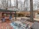 Outdoor seating area on a deck with a shade pergola overlooking the backyard and trees at 6141 Flamingo Dr, Nineveh, IN 46164