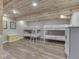 Basement featuring bunk beds, wood look floors, and a wood ceiling at 6141 Flamingo Dr, Nineveh, IN 46164
