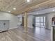 Spacious basement featuring wood-look flooring, sliding glass doors, and ample lighting at 6141 Flamingo Dr, Nineveh, IN 46164