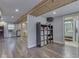 Finished basement with plank floors, storage cube, and adjacent bathroom with vanity and tiled shower at 6141 Flamingo Dr, Nineveh, IN 46164