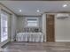 Finished basement area with daybed, door to outside, window, closet and wall air conditioner at 6141 Flamingo Dr, Nineveh, IN 46164