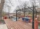 View of the covered dining area with a table and seating on the deck overlooking the lake at 6141 Flamingo Dr, Nineveh, IN 46164