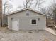 Exterior side view of home with siding, white door, window, flamingo art, gravel, and ramp to dock at 6141 Flamingo Dr, Nineveh, IN 46164