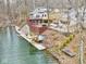 Lakeside homes feature multi-tiered decks, stairs and a boat dock for waterfront living at 6141 Flamingo Dr, Nineveh, IN 46164