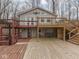 Two-story home with decks and stairs offering scenic outdoor living spaces at 6141 Flamingo Dr, Nineveh, IN 46164