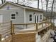 Charming home exterior features light gray siding, white trim, and a spacious wooden deck at 6141 Flamingo Dr, Nineveh, IN 46164