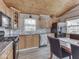 Charming kitchen with wood cabinets, modern appliances, and adjacent dining area at 6141 Flamingo Dr, Nineveh, IN 46164