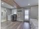 Laundry area with washer/dryer, laundry sink, adjacent walk-in shower and access to the exterior at 6141 Flamingo Dr, Nineveh, IN 46164