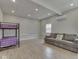 Relaxing living room featuring a comfortable gray couch, a bunkbed, and recessed lighting at 6141 Flamingo Dr, Nineveh, IN 46164