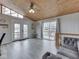 Living room featuring doors to a deck, vaulted ceiling and dining area, perfect for indoor/outdoor entertaining at 6141 Flamingo Dr, Nineveh, IN 46164