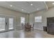 Living space with table and chairs, refrigerator, and doors to outdoor porch area at 6141 Flamingo Dr, Nineveh, IN 46164